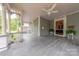 Front porch features wood flooring, white railings, and a ceiling fan at 404 W Kerr St, Salisbury, NC 28144