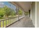 Long front porch with white railings and view of trees at 404 W Kerr St, Salisbury, NC 28144