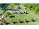 Aerial view of a beautifully landscaped property showcasing the manicured lawn and trees at 796 Cornelius Rd, Mooresville, NC 28117