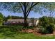 Spacious backyard with a well-maintained lawn, mature trees, and a privacy fence at 796 Cornelius Rd, Mooresville, NC 28117