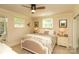 Comfortable bedroom with neutral walls, carpet, and a queen bed with soft bedding and side tables at 796 Cornelius Rd, Mooresville, NC 28117
