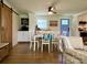 Traditional dining room featuring hardwood floors, a rustic sliding barn door, and seating for six around a wooden table at 796 Cornelius Rd, Mooresville, NC 28117