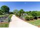 Private driveway leading to a charming home, bordered by mature landscaping and trees at 796 Cornelius Rd, Mooresville, NC 28117