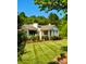 Charming home featuring well-maintained lawn, lush landscaping, and a classic architectural style at 796 Cornelius Rd, Mooresville, NC 28117