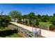 Beautiful home showcasing manicured landscaping and a gated driveway leading to the residence at 796 Cornelius Rd, Mooresville, NC 28117