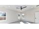 Sunlit bedroom with neutral walls, plush carpet, ceiling fan, and double windows at 1108 Piper Meadows Dr # 52, Waxhaw, NC 28173
