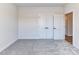 A bright bedroom with carpet and closet doors offers versatile use of the space at 1108 Piper Meadows Dr # 52, Waxhaw, NC 28173