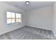 Bedroom featuring neutral carpeting, a large window and natural light at 1108 Piper Meadows Dr # 52, Waxhaw, NC 28173