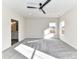 Bright bedroom featuring plush carpet, a modern ceiling fan, and natural light from two windows at 1108 Piper Meadows Dr # 52, Waxhaw, NC 28173