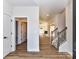 Bright foyer with hardwood floors leads to the staircase and living area at 1108 Piper Meadows Dr # 52, Waxhaw, NC 28173