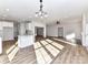Open-concept living space features a kitchen, dining area, and fireplace at 1108 Piper Meadows Dr # 52, Waxhaw, NC 28173