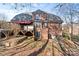 Exterior view of the brick home with covered deck at 2012 Tomshire Dr, Gastonia, NC 28056