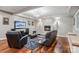 Cozy basement featuring a fireplace, comfortable seating, and hardwood floors at 2012 Tomshire Dr, Gastonia, NC 28056