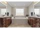 A luxurious bathroom featuring double vanities and a large soaking tub at 2012 Tomshire Dr, Gastonia, NC 28056