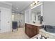 Bathroom with a glass-enclosed shower and a dark wood vanity with marble countertop at 2012 Tomshire Dr, Gastonia, NC 28056