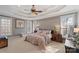 Spacious bedroom with soft decor, multiple windows, and neutral color scheme at 2012 Tomshire Dr, Gastonia, NC 28056