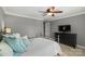 Comfortable bedroom with a ceiling fan, a flatscreen television, and neutral colors at 2012 Tomshire Dr, Gastonia, NC 28056