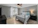 Sunlit bedroom features a metal bed frame, bedside tables, and soft, neutral decor at 2012 Tomshire Dr, Gastonia, NC 28056