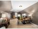 Spacious bonus room with carpeted floors, multiple work stations and lots of storage at 2012 Tomshire Dr, Gastonia, NC 28056