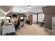 Large bonus room with multiple work stations with desks, chairs, and lots of natural light at 2012 Tomshire Dr, Gastonia, NC 28056