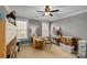 Bright craft room with desk, shelving, and carpet flooring at 2012 Tomshire Dr, Gastonia, NC 28056