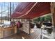 Covered deck with an outdoor kitchen, stainless steel grill, bar and wicker seating at 2012 Tomshire Dr, Gastonia, NC 28056