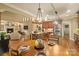 Cozy dining area with a view of the open-concept living room and modern kitchen at 2012 Tomshire Dr, Gastonia, NC 28056