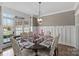 Formal dining room featuring hardwood floors and a beautifully set table at 2012 Tomshire Dr, Gastonia, NC 28056