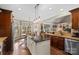 Bright kitchen featuring granite counters, stainless steel appliances, and an island with pendant lighting at 2012 Tomshire Dr, Gastonia, NC 28056