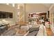 Spacious living room with an open floor plan, hardwood floors, and seamless flow to the modern kitchen at 2012 Tomshire Dr, Gastonia, NC 28056