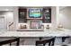 Stylish wet bar with marble countertops, custom cabinets, and a sink at 2012 Tomshire Dr, Gastonia, NC 28056