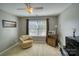 Bright bedroom featuring a comfortable armchair and window seating at 1148 Mckee Farm Ln, Belmont, NC 28012