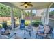 Relaxing screened porch with seating area and backyard views at 1148 Mckee Farm Ln, Belmont, NC 28012