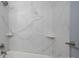 Bathroom with marble-tiled shower/tub combo and corner shelves at 1571 Branchville Rd, Shelby, NC 28150