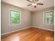 Well-lit bedroom with hardwood floors and ceiling fan at 1571 Branchville Rd, Shelby, NC 28150