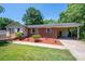 Brick ranch house with carport, landscaping, and a spacious yard at 1571 Branchville Rd, Shelby, NC 28150