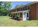 Brick house with sunroom and a nicely landscaped yard at 1571 Branchville Rd, Shelby, NC 28150