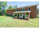 Brick ranch house with sunroom and well-maintained lawn at 1571 Branchville Rd, Shelby, NC 28150