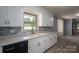 White kitchen cabinets and a modern sink at 1571 Branchville Rd, Shelby, NC 28150