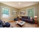 Cozy living room featuring a comfortable sectional sofa and large windows at 1571 Branchville Rd, Shelby, NC 28150