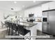 Modern kitchen with a granite island, stainless steel appliances, and open dining area at 1534 Wembley Dr, Charlotte, NC 28205