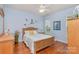 Charming bedroom with hardwood floors, wood furniture and nautical accents at 4218 Rosy Billed Ct, Fort Mill, SC 29707