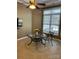 Charming breakfast nook area with a modern table set, complemented by natural light streaming through a large window at 4218 Rosy Billed Ct, Fort Mill, SC 29707