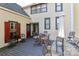 Outdoor porch featuring a patio set, umbrella, and a charming backyard view at 235 Walnut St, Statesville, NC 28677