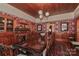 Elegant dining room features a long wooden table, fireplace, and decorative wallpaper at 235 Walnut St, Statesville, NC 28677