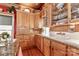Farmhouse kitchen boasts a copper ceiling, custom cabinetry, granite countertops, and farmhouse sink at 235 Walnut St, Statesville, NC 28677