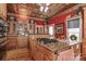 Gourmet kitchen featuring a granite island, gas cooktop, and custom wood cabinetry at 235 Walnut St, Statesville, NC 28677