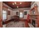 Elegant living room featuring a grand piano, fireplace, and period details at 235 Walnut St, Statesville, NC 28677