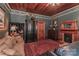 Charming living room showcasing a fireplace, dark green walls, wood ceiling and elegant furnishings at 235 Walnut St, Statesville, NC 28677