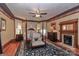 Main bedroom featuring a four-poster bed, fireplace, and elegant decor at 235 Walnut St, Statesville, NC 28677